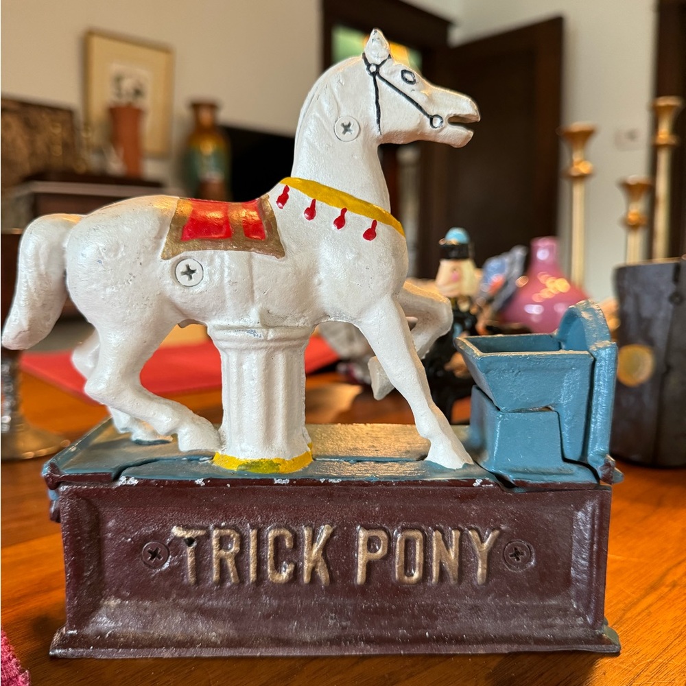 Three vintage, mechanical banks, and a bonus nutcracker